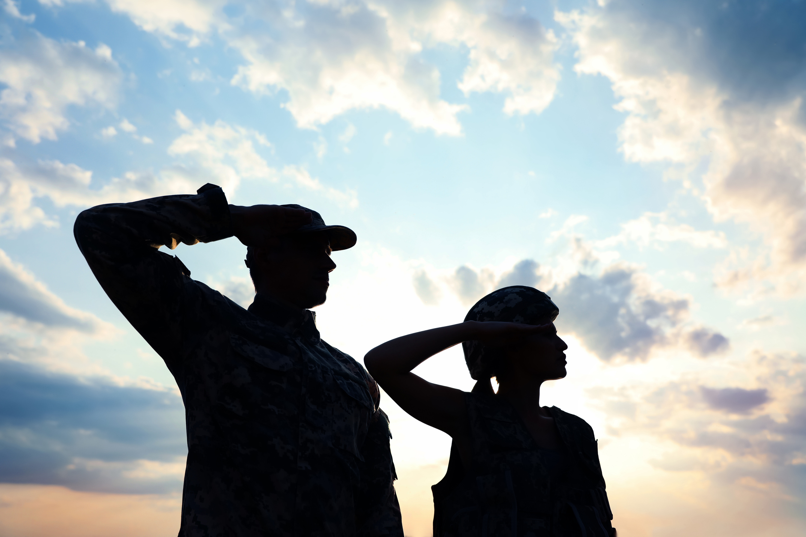 Soldiers in Uniform Saluting Outdoors. Military Service